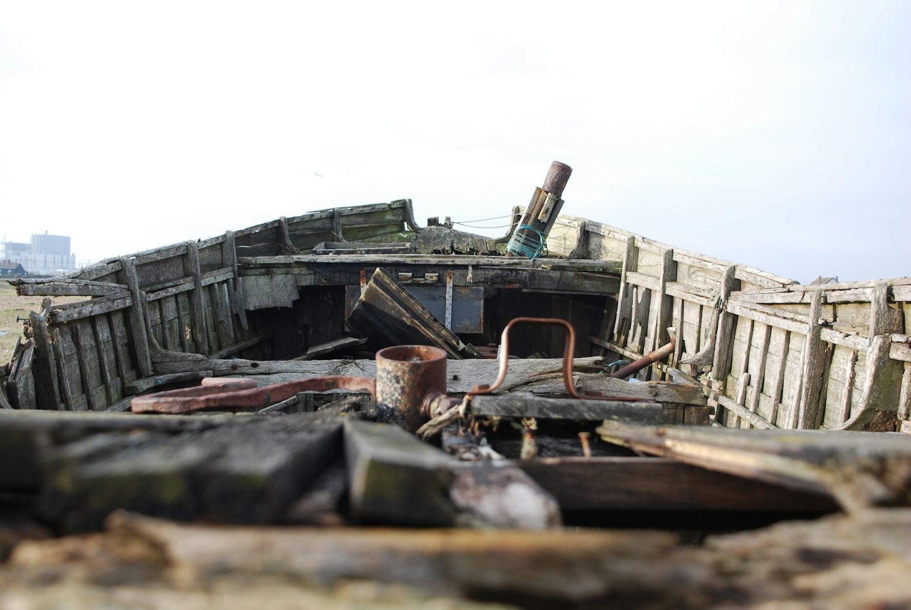 Weathered wooden fishing boat on the shore