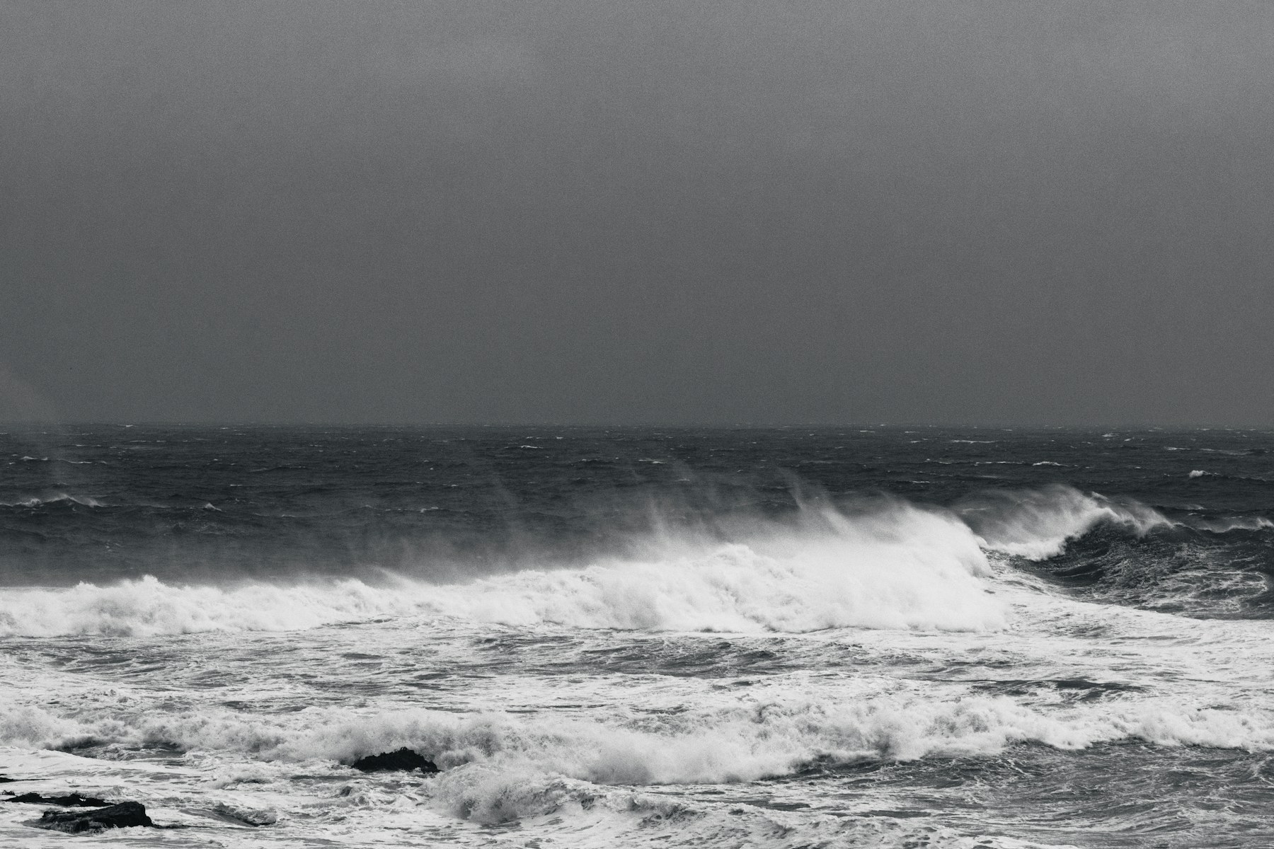 Breaking ocean waves in black and white